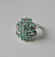 Silver ring with emerald stones