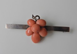 Silver brooch decorated with antique coral beads