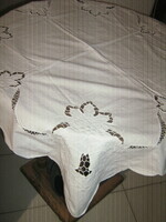 Beautiful special white rosette tablecloth with a Christmas pattern in the four corners