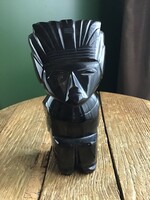 Old carved obsidian mineral statue