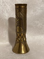 A vase made of brass cartridges with a bird forest in relief is a significant unique handicraft ornament