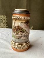 Ceramic beer mug with lid.