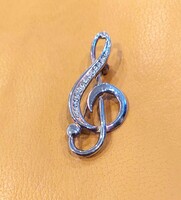 Treble clef shaped brooch decorated with stones