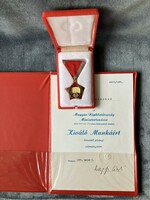 Award for excellent work in a box with a donation document