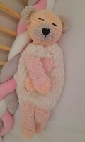 Hand crocheted sleeping teddy bear.