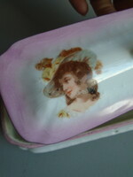 Antique toothbrush holder with lady.