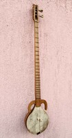 Central Asian winged rebab long-necked stringed instrument. With leather cover