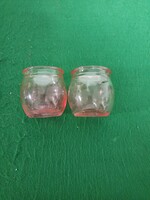 Two small old pink bottles.