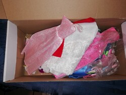 Barbie doll clothes and accessories in a box