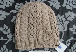 Hand-knitted women's hat with flowers
