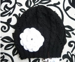 Black, hand-knitted women's hat with flowers