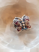 Silver charm bracelet in the shape of a butterfly, decorated with ruby stones