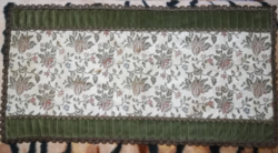 Antique running tablecloth with gilded border.