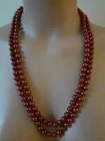 A long string of glass tekla beads