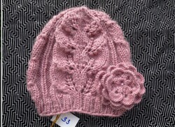 Pink, hand-knitted women's hat with flowers