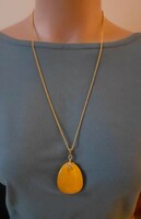 Beautiful, gold-colored necklace with a larger Baltic amber pendant