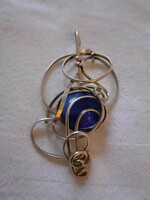 A special, large industrial artist pendant, decorated with a large blue glass lens