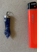 Silver and lapis lazuli pendant in the shape of a hand