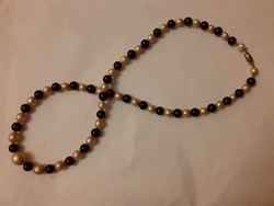 Old string of beads combining black glass and tekla beads