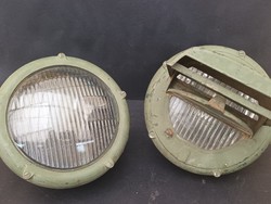 A pair of old military large camouflage headlights
