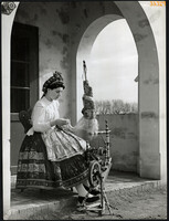 Larger size, photo art work by István Szendrő. Young woman, in folk costume, disabled, őcsény