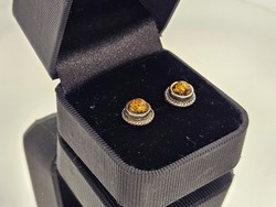 Silver earrings decorated with amber