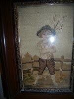 Framed in a romantic, artistic quality needle tapestry, from the early years of the 20th century