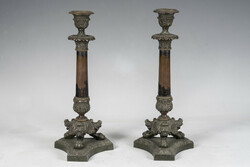 Pair of bronze candlesticks with stylized lion feet