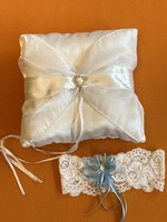 White ring pillow with garter belt.