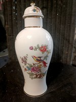 A large vase with a lid is cheap - also great as a gift!