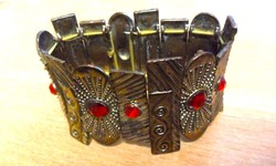 More beautiful than in the pictures! Antique bracelet made of copper plates with red stones.