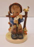 Antique hummel porcelain figurine of a boy with flowers