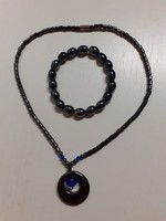 Nice condition magnetite necklace with a heart-shaped pendant with a blue glass stone in it and a bracelet