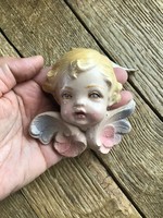 Old painted wall ceramic angel eye ornament