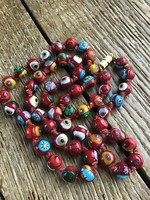 Row of old Murano millefiori beads