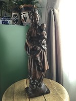 Old carved wooden statue with baby Jesus
