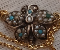 Antique gold and silver necklaces studded with turquoise and pearls