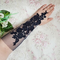 New, custom-made, dark blue embroidered lace gloves that can be hung on the finger