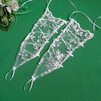 New, custom-made ecru embroidered lace gloves for children that can be hung on the finger