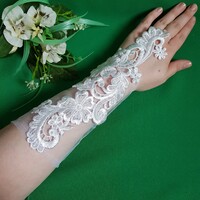 New, custom-made, white bridal embroidered lace gloves that can be hung on the finger
