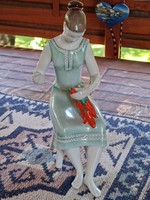 Figure of a girl from Hóllóháza wearing pepper laces