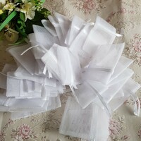 New, custom-sized snow-white hard/stiff tulle decorative bags, gift bags