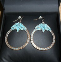 Boho-style, flower-patterned, turquoise-bronze earrings.