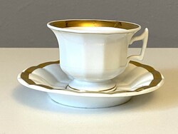Antique thickly gilded white porcelain coffee cup and saucer