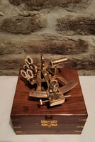 Brass sextant in a wooden box