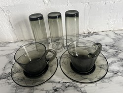 Smoke-colored glass coffee cups and liqueur or brandy glasses