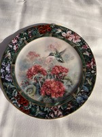 A dreamy lena liu porcelain numbered decorative plate that can also be hung on the wall