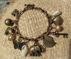 Showy vintage bracelet with many pendants