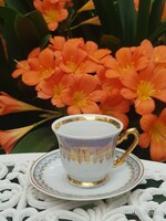Marked coffee cup and saucer