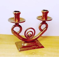 Copper candle holder. A work of applied art, a rarity in a rustic environment